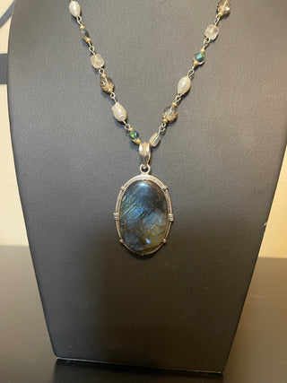 Stunning labradorite set in sterling silver on a pearl and blue accent chain
